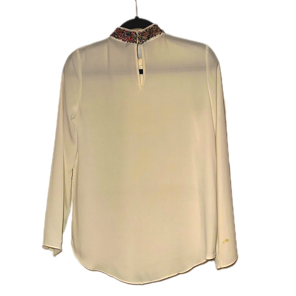 Long sleeve top with multi color beaded neck.